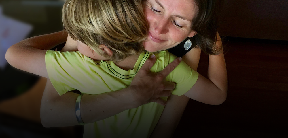 Woman hugging child