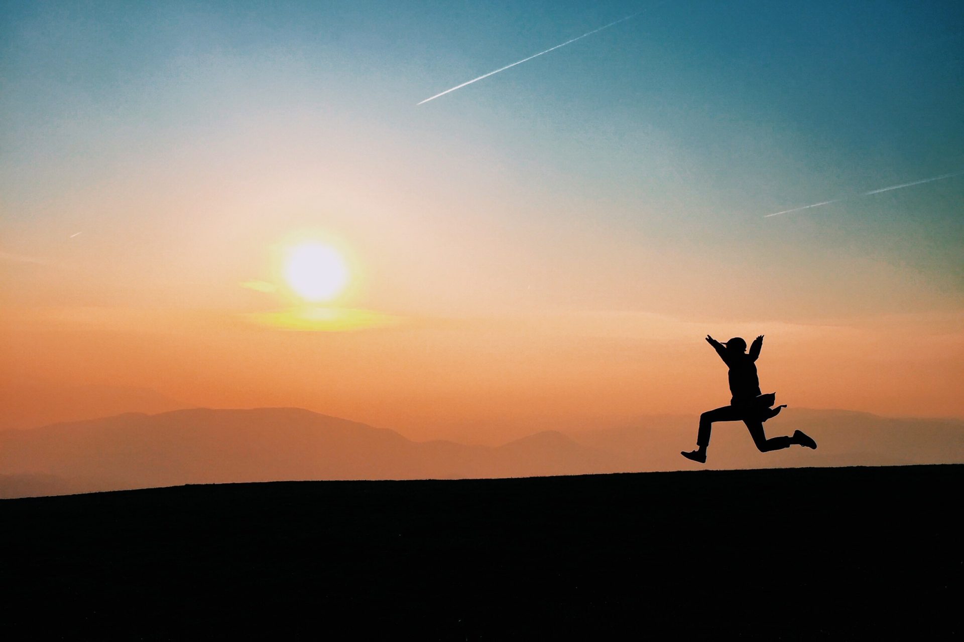 Man running during a sunset