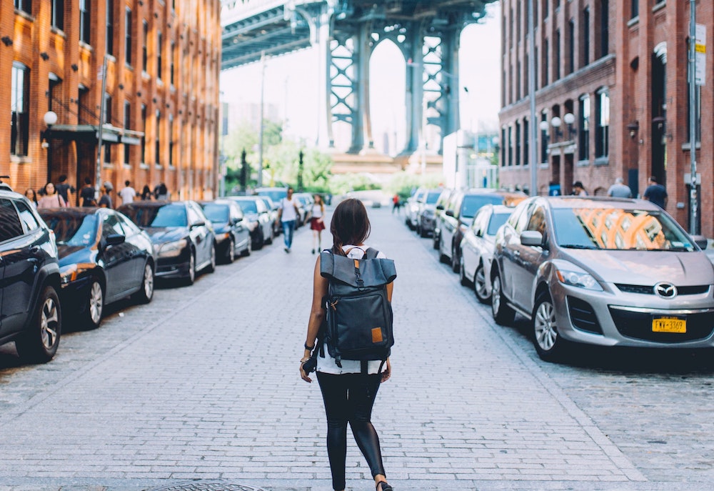 Woman in New York looking at Brooklyn bridge