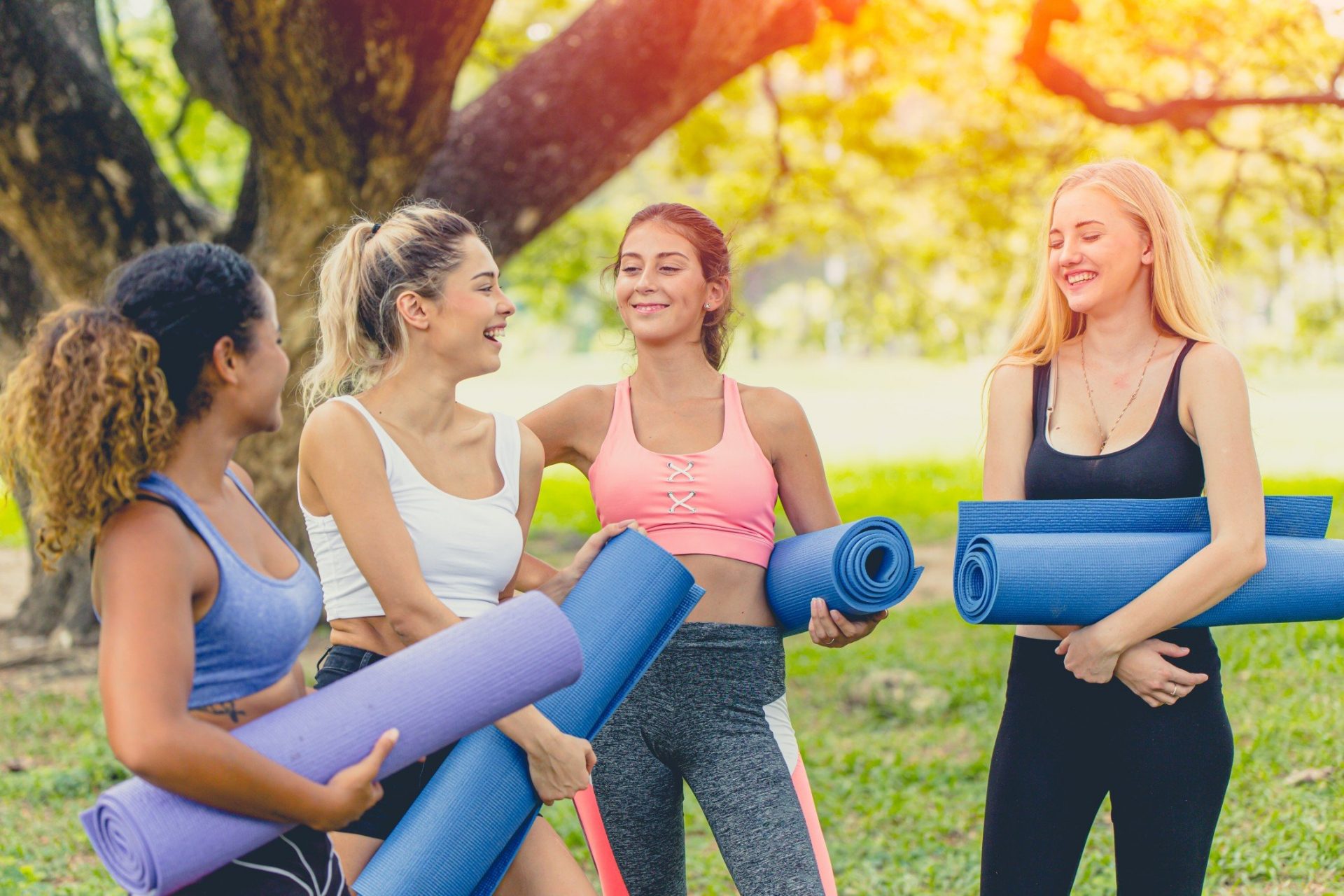 green park discussing talking standing together join meeting relax yoga class group women young