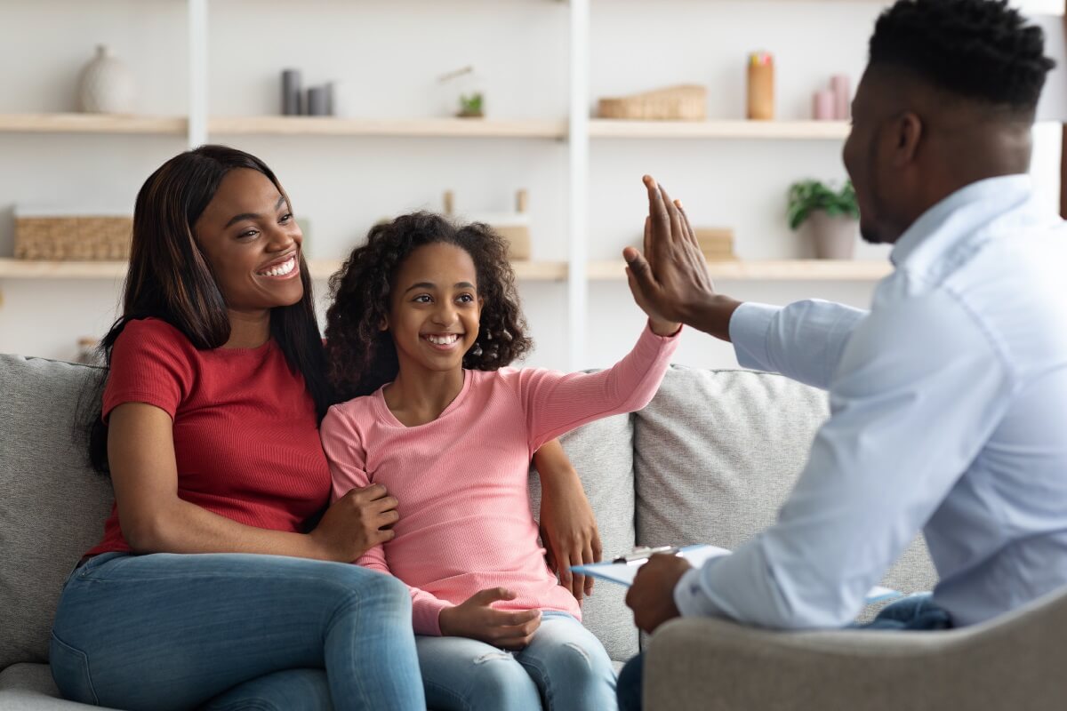 African American mother and daughter at appointment with ABA provider