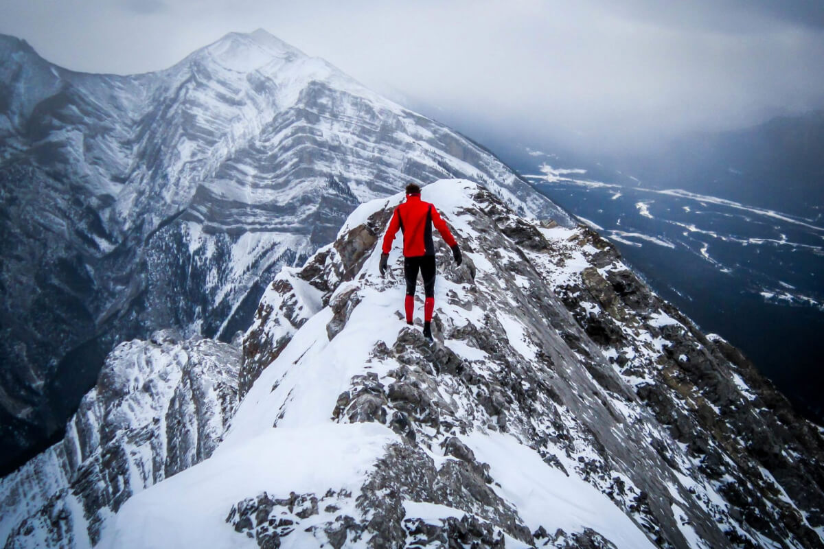 Man at the top of a mountain